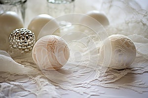 glass-blown ornaments on a delicate lace tablecloth