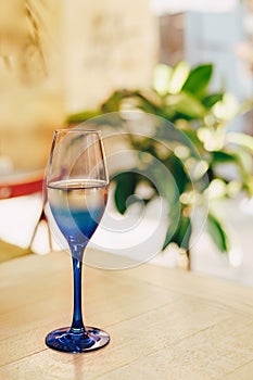 Glass of blue color with champagne table i