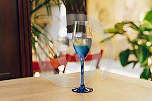 Glass of blue color with champagne table i