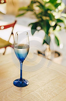 Glass of blue color with champagne table i