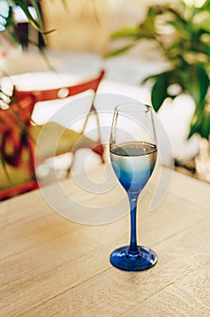 Glass of blue color with champagne table i