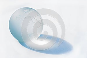Glass blue globe (close up view) photo