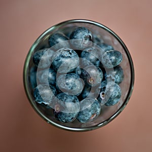 Glass of blueberries from above