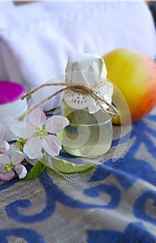 A glass bottle of apple blossoms extract.