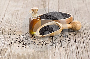 Glass bottle of black cumin seeds essential oil , Nigella Sativa