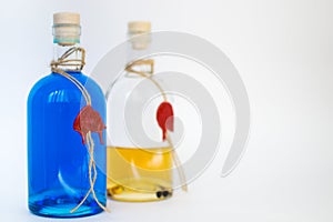 Glass bottle with blue Curacao alcohol and lemon color