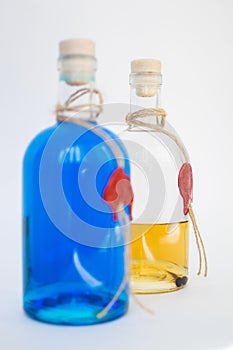 Glass bottle with blue Curacao alcohol and lemon color