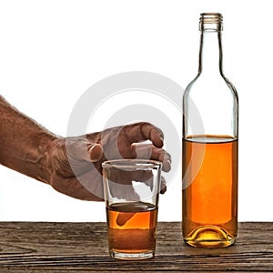 Glass and bottle of brandy isolated on the white
