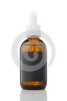 Glass bottle for cosmetics and medicine with a pipette isolated on white background