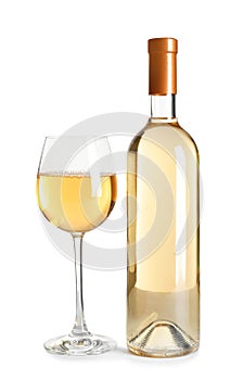 Glass and bottle of delicious wine on white