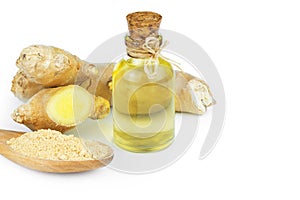Glass bottle of essential ginger oil, ginger root and powder isolated on white background