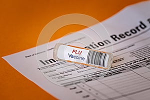 Glass Bottle with Flu Vaccine Label Attached