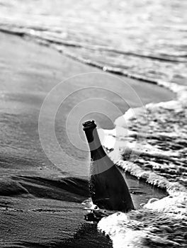 glass bottle found on the seashore which may contain a message a