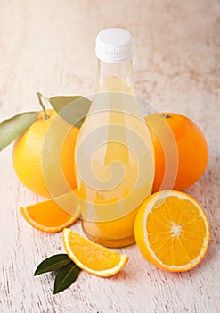 Glass  bottle of fresh mandarin tangerine juice