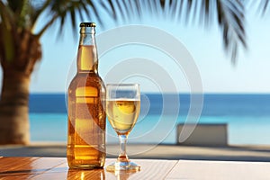 A glass bottle of fresh open beer on a wooden table outdoors