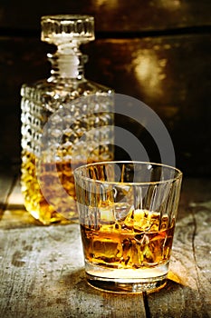 Glass and bottle of hard liquor