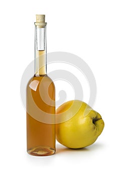 Glass bottle of homemade quince liqueur