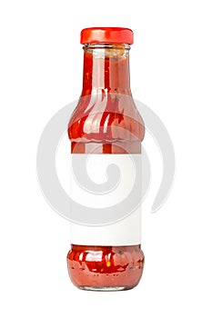 glass bottle of hot tomato sauce on white background with copy space