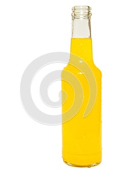 Glass bottle of orange soda isolated on white