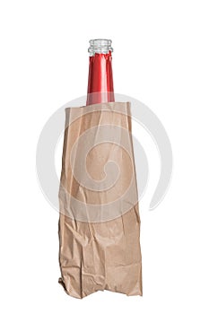 Glass bottle in a paper bag isolated on white background