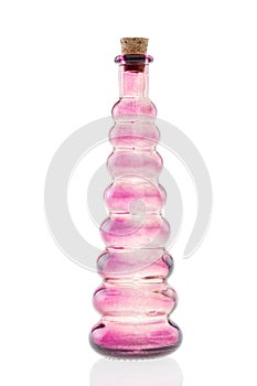 Glass bottle pink with cork stopper isolated
