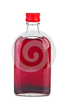 Glass bottle with pomegranate sirup