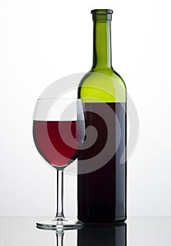 Glass and bottle of red wine