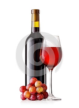 Glass and bottle of red wine with grapes