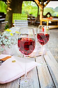 One glass and bottle of the rose wine in autumn vineyard. Harvest time, Summertime