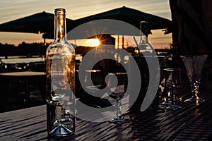 Glass bottle at sunset