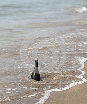 glass bottle transported from the sea to the shore