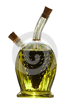 A glass bottle of virgin olive oil and balsamic vinegar in close-up. Two containers in one bottle. Isolated