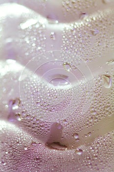 Glass bottle with water droplets