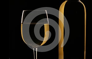 Glass and bottle of white wine