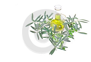 Glass bottle wtih extra virgin olive oil and olive branches. Olive tree brunch with olives isolated on white background.