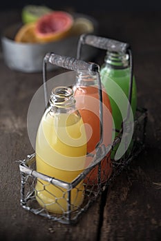 Glass bottles of assorted fresh fruit juice