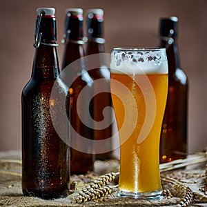 Glass and bottles of beer