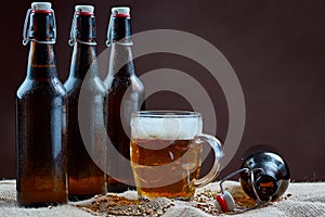 Glass and bottles of beer