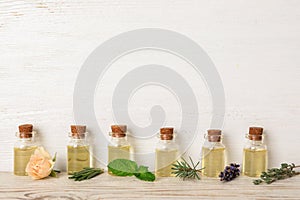 Glass bottles with different essential oils and herbs