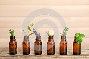 Glass bottles with different essential oils and herbs