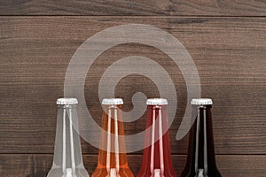 Glass bottles of different sweet drinks