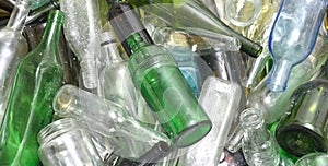 Glass bottles inside a glass recycling