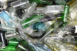 Glass bottles inside a glass recycling
