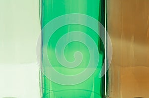 Glass bottles of mixed colors including green, clear white, brow