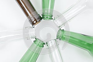 Glass bottles of mixed colors including green, clear white, brow