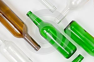 Glass bottles of mixed colors including green, clear white, brow