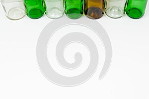 Glass bottles of mixed colors including green, clear white, brow