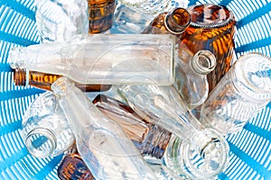 Glass bottles in waste basket