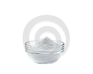 Glass bowl of baking soda isolated on white background. Glass bowl of sodium bicarbonate  isolated on white background