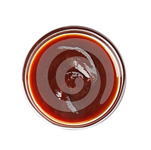 Glass bowl of barbecue sauce on white background